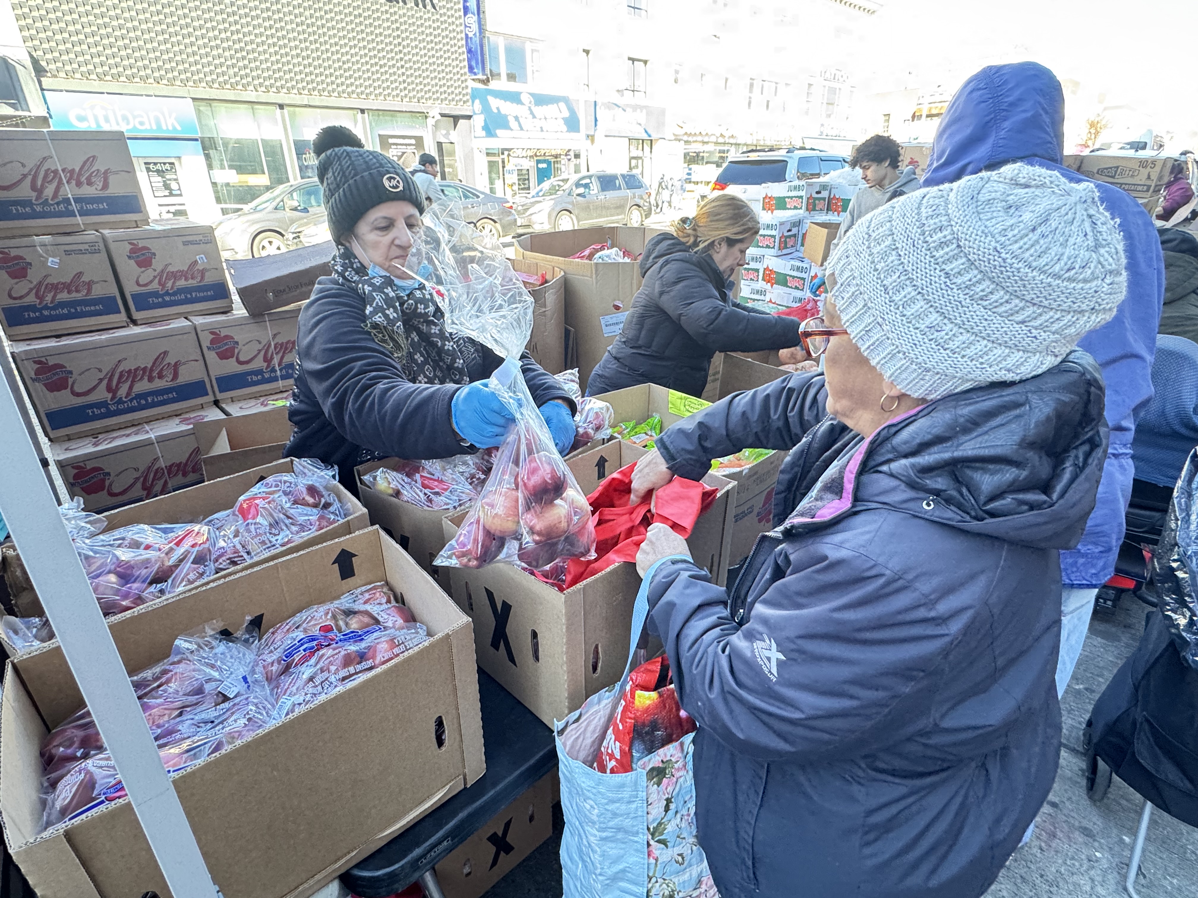 Met Council volunteers preparing food packages for New York families